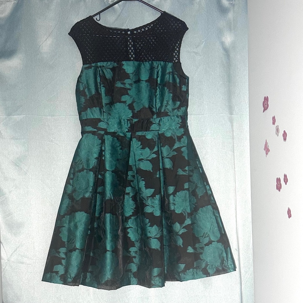 Green and black cocktail dress with floral design